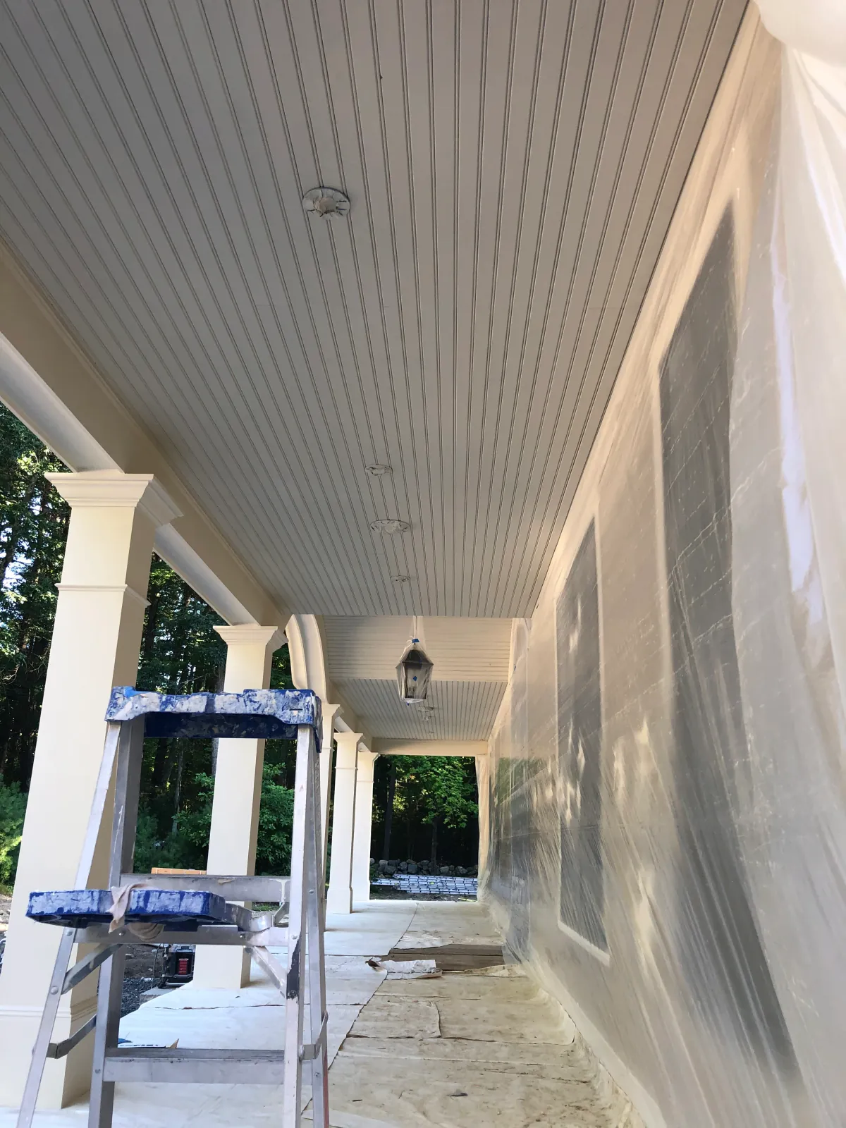 Same ceiling before — water-stained and yellowed