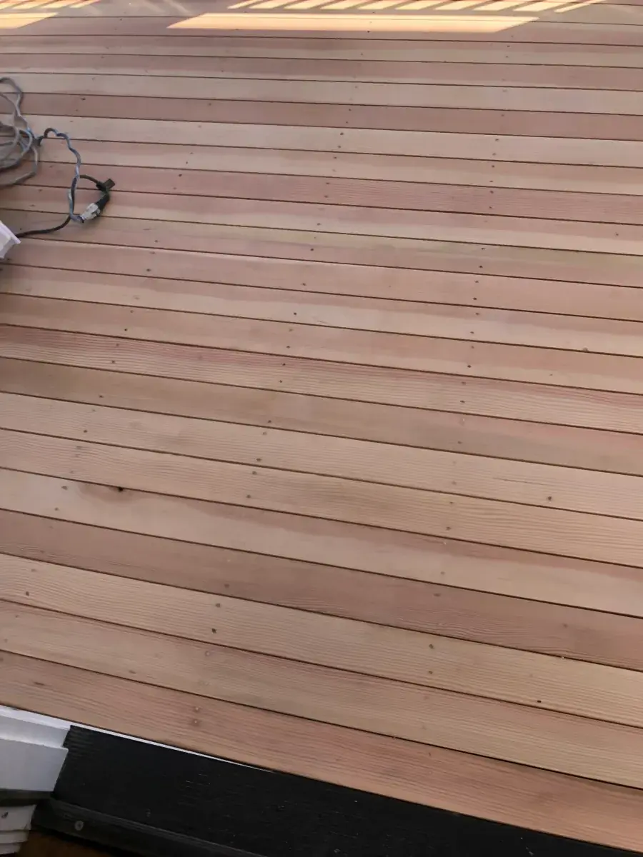 Closeup detail of newly stained deck boards showing grain and finish