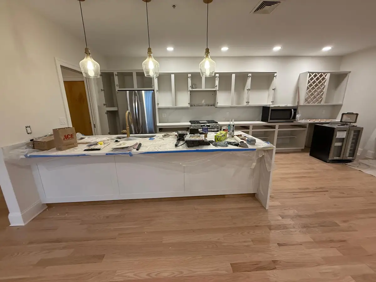 Same Newton kitchen during the project: doors removed and counters protected