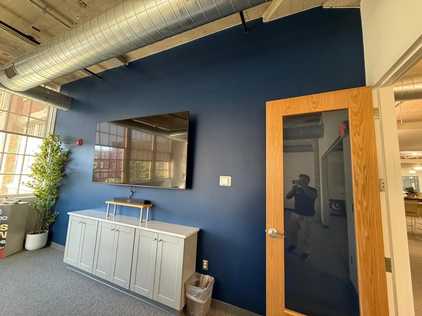 Navy accent wall in a loft-style office in Framingham, MA