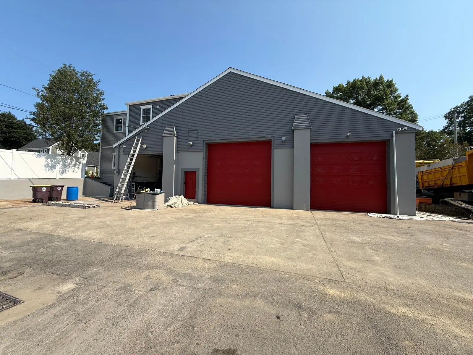 Side angle of the painted garage doors and pilasters in Weymouth