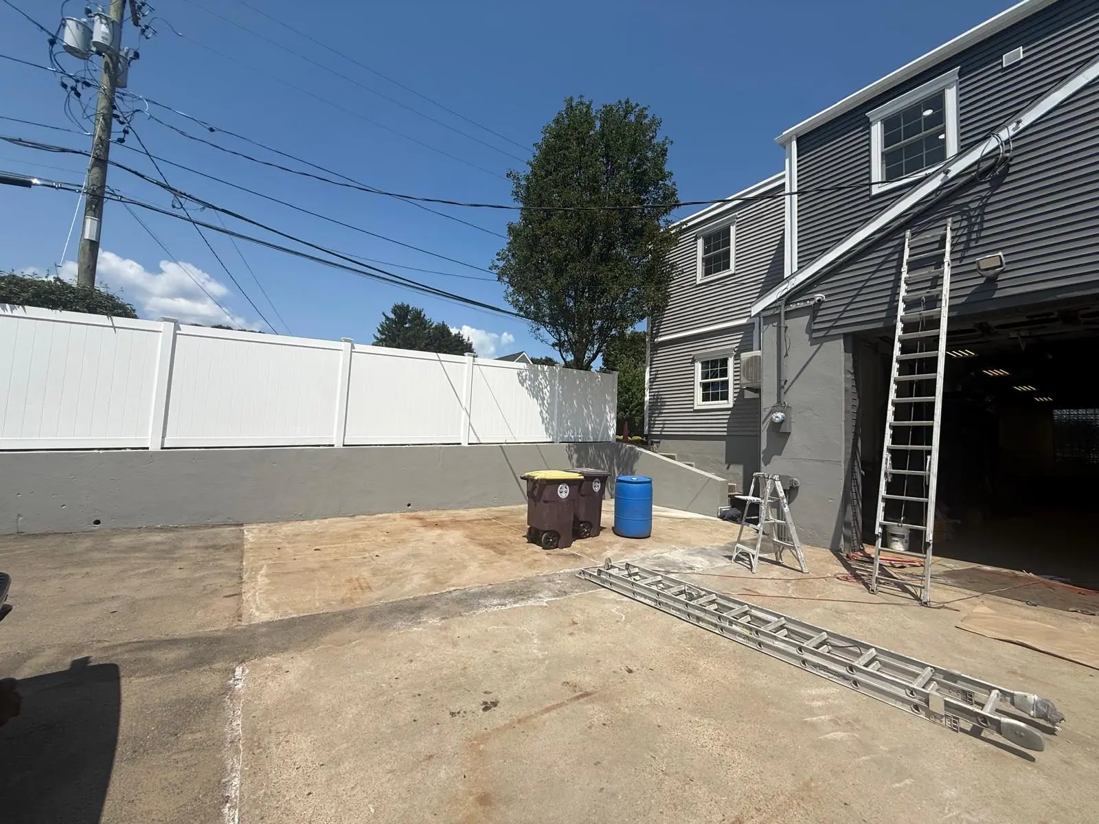 Ladder and staging along the side of the Weymouth garage building